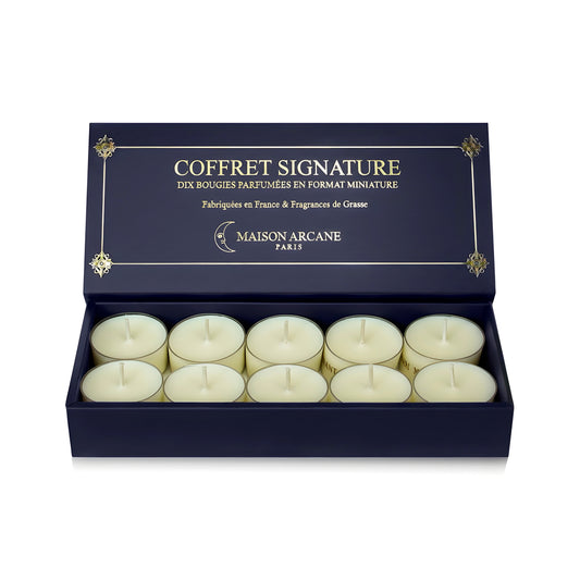 Coffret ouvert de dix bougies chauffe-plat parfumées Signature Maison Arcane, affichage des mini bougies pour découverte olfactive.