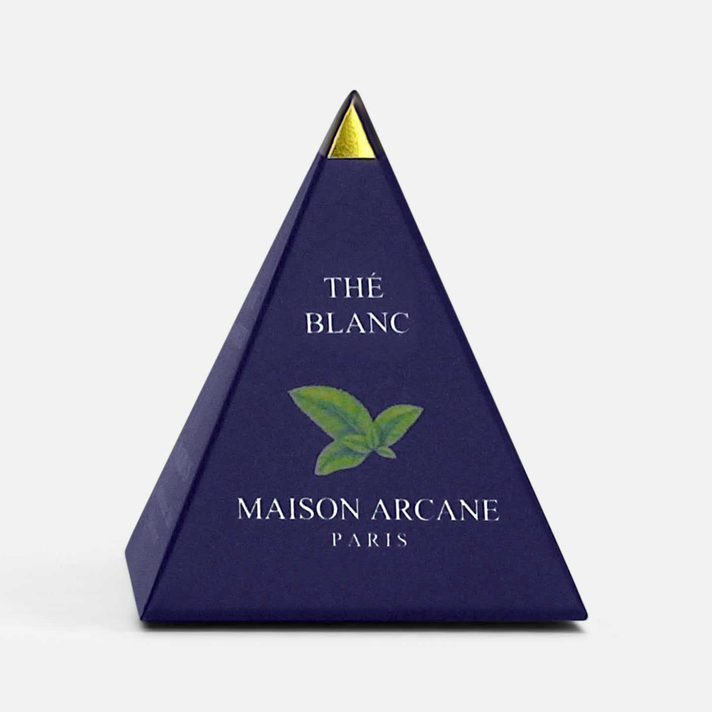 Infusette pyramidale bleu marine et dorée, packaging thé blanc et logo Maison Arcane.