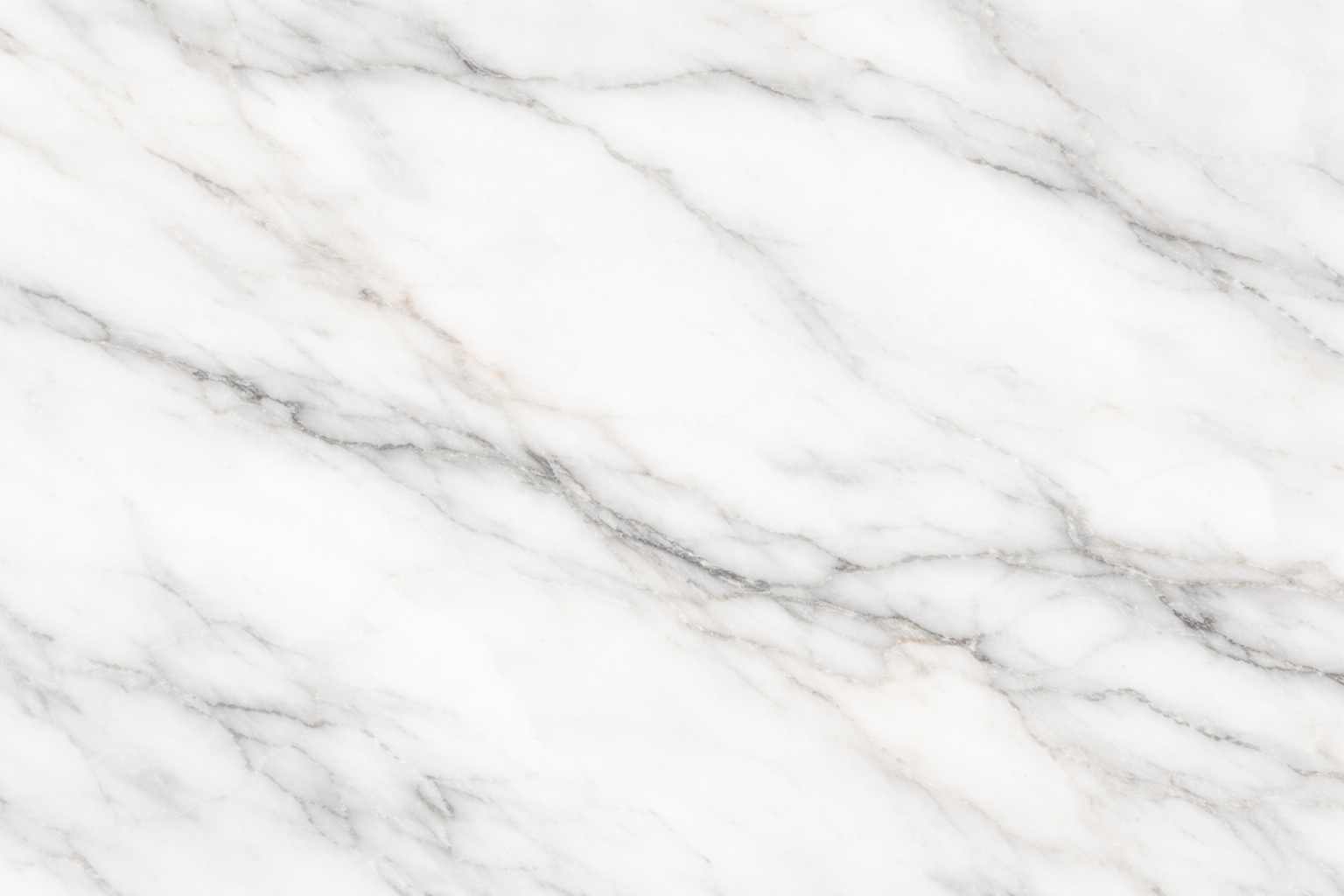 Gros plan de marbre blanc avec des nervures grises naturelles, texture élégante et raffinée.