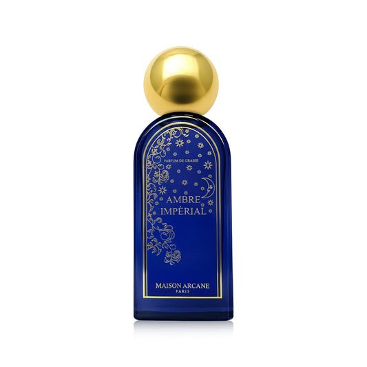 Parfum d’intérieur Ambre Impérial de Maison Arcane avec flacon élégant bleu et doré, inspiration orientale, fragrance ambre noir, senteur épicée et ambrée.